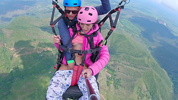 Paragliding adventure turns into solo pleasure as girl fingers her wet pussy to climax